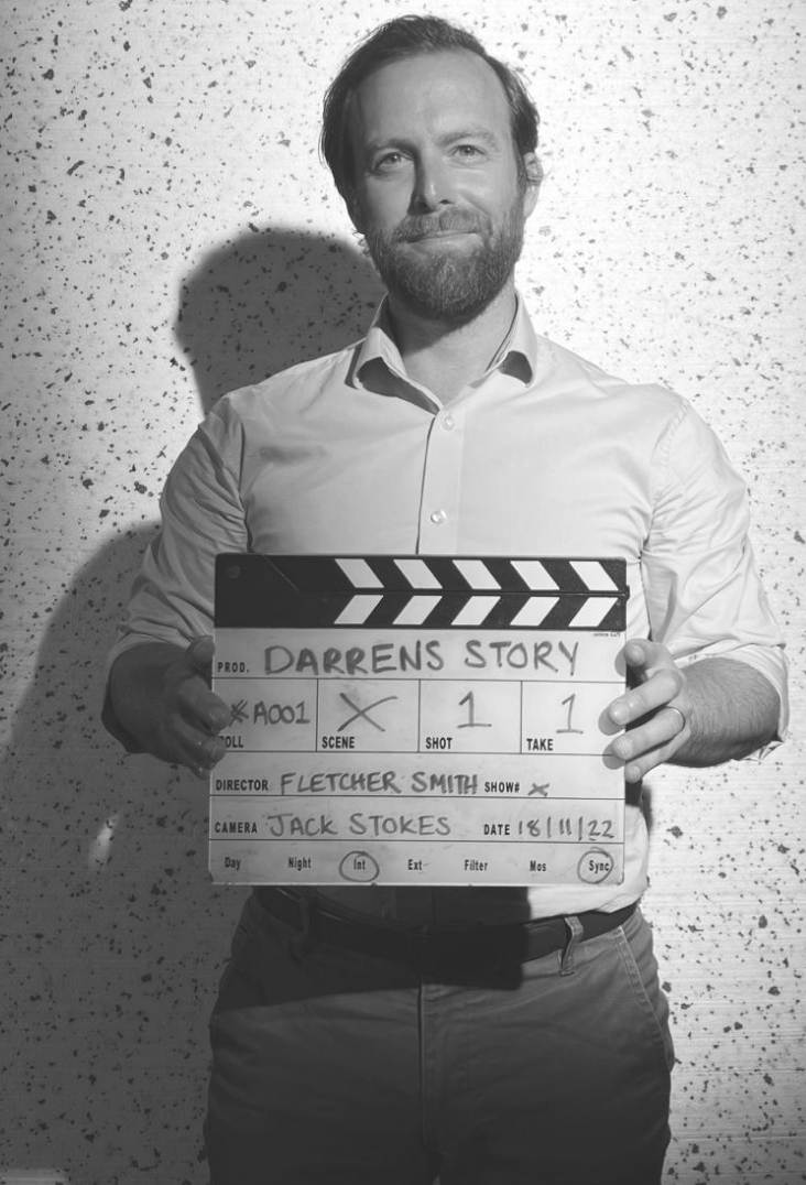 Darren holding clapper board